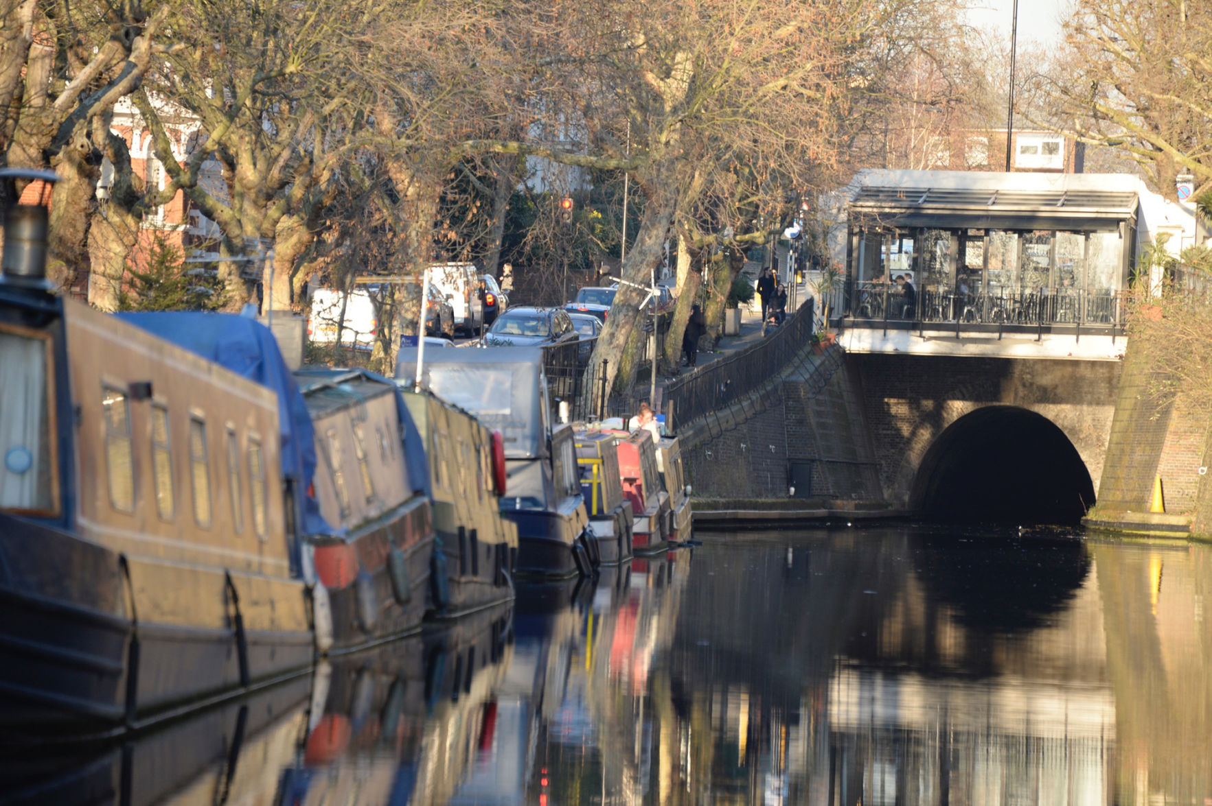 Low tunnel, everybody down: Houseboats along London's Regent's Canal. Tours are offered by The London Waterbus Company.